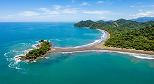 Aerial view of the Uvita coastline and jungle, a nature-focused destination for a retreat in Costa Rica