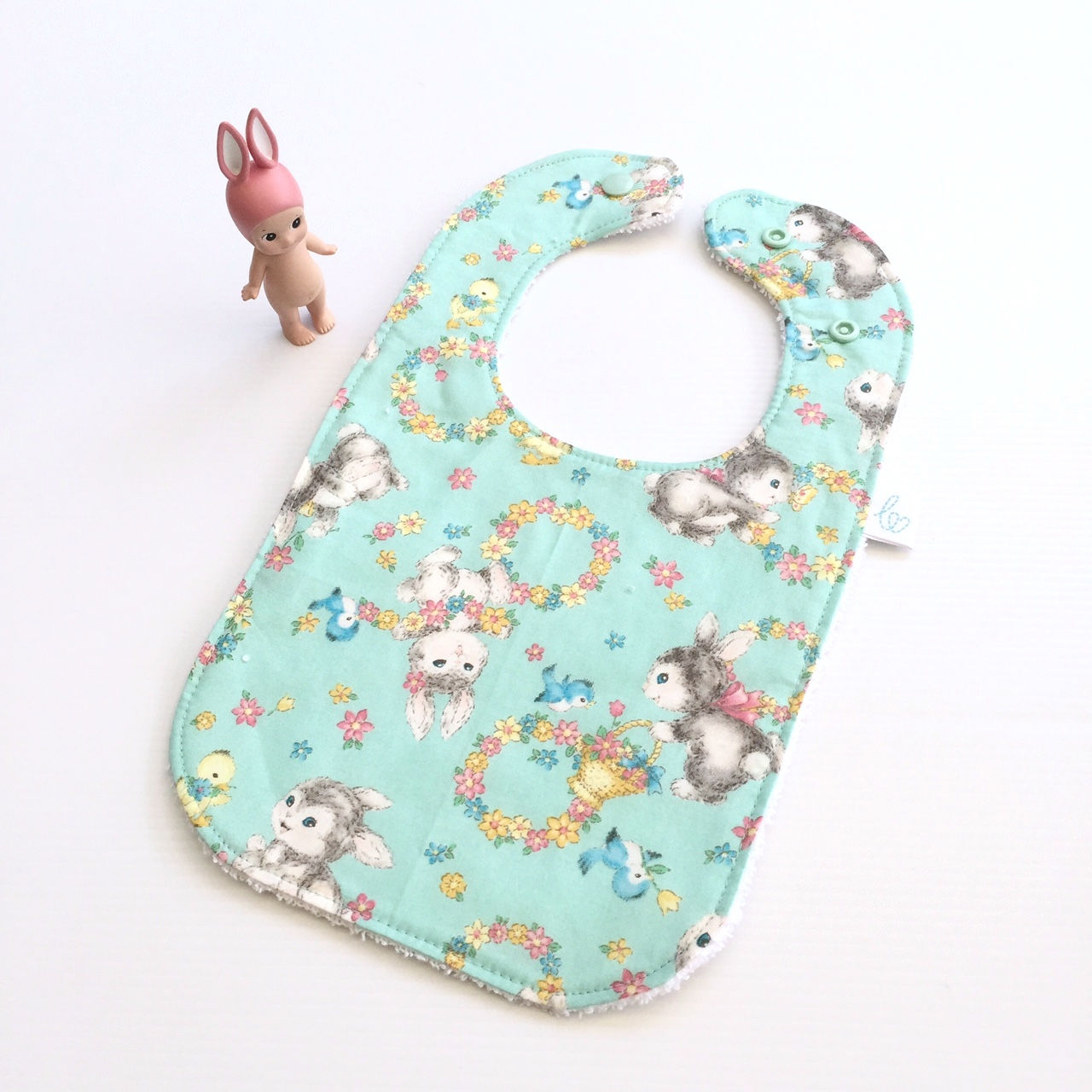 Vintage bunnies in blue bib