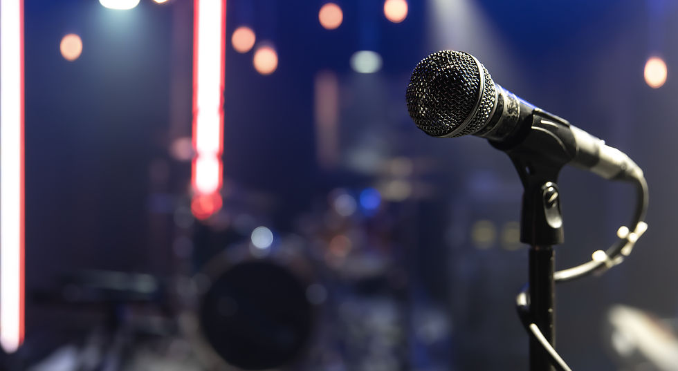 close-up-microphone-concert-stage-with-beautiful-lighting_edited.jpg