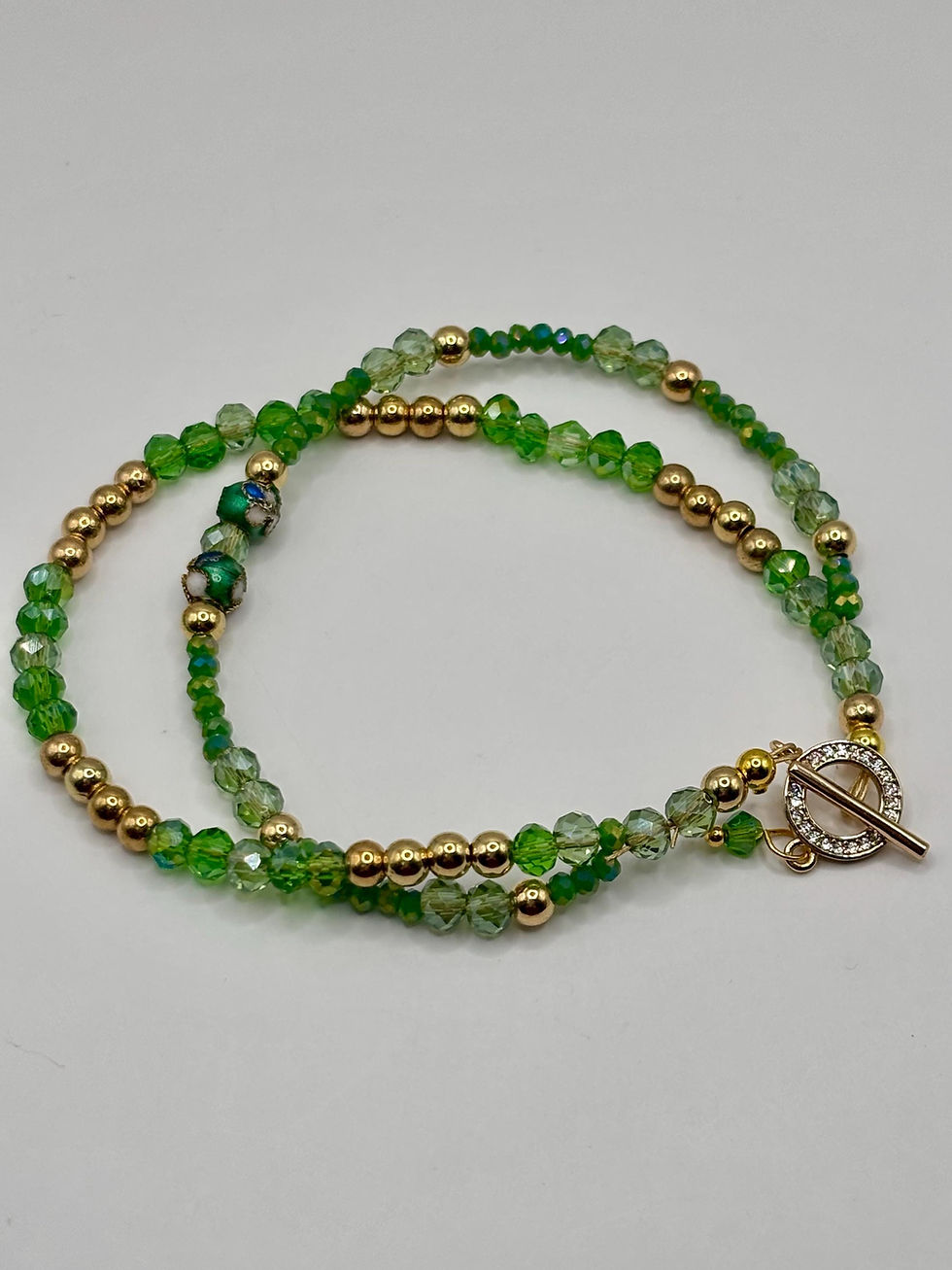 Thumbnail: Green crystal double strand beaded bracelet with gold accents