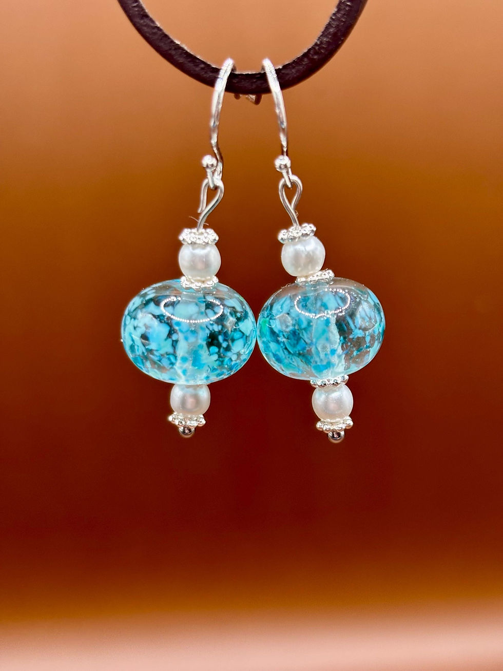 Thumbnail: Blue lampwork dangle earrings with pearls on silver wires