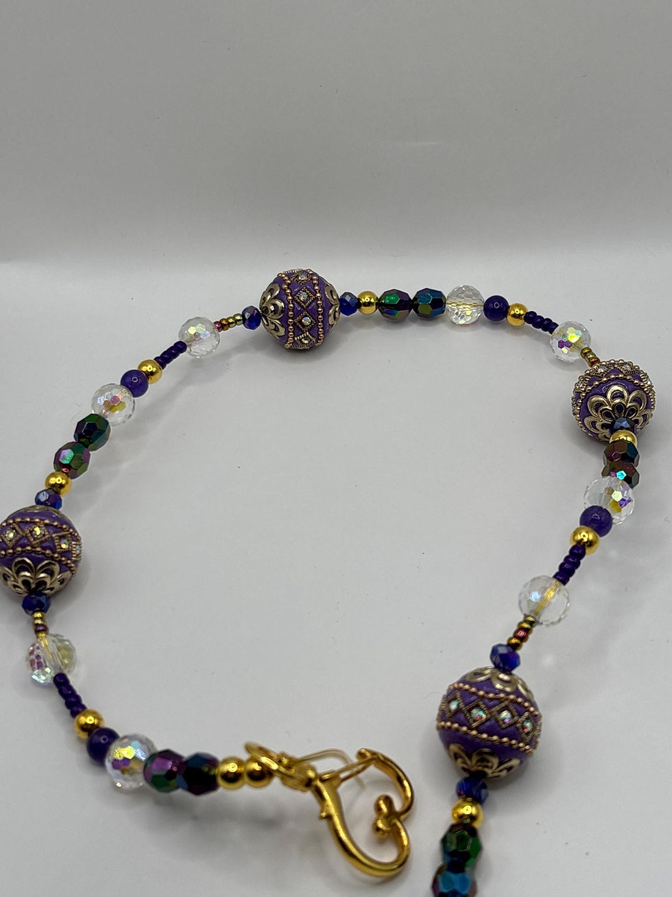 Thumbnail: Royal purple beaded purse chain with gold filigree beads.