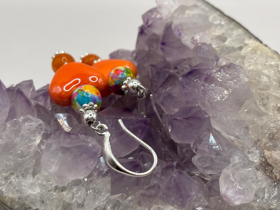 Thumbnail: Orange heart beaded earrings on purple amethyst crystal