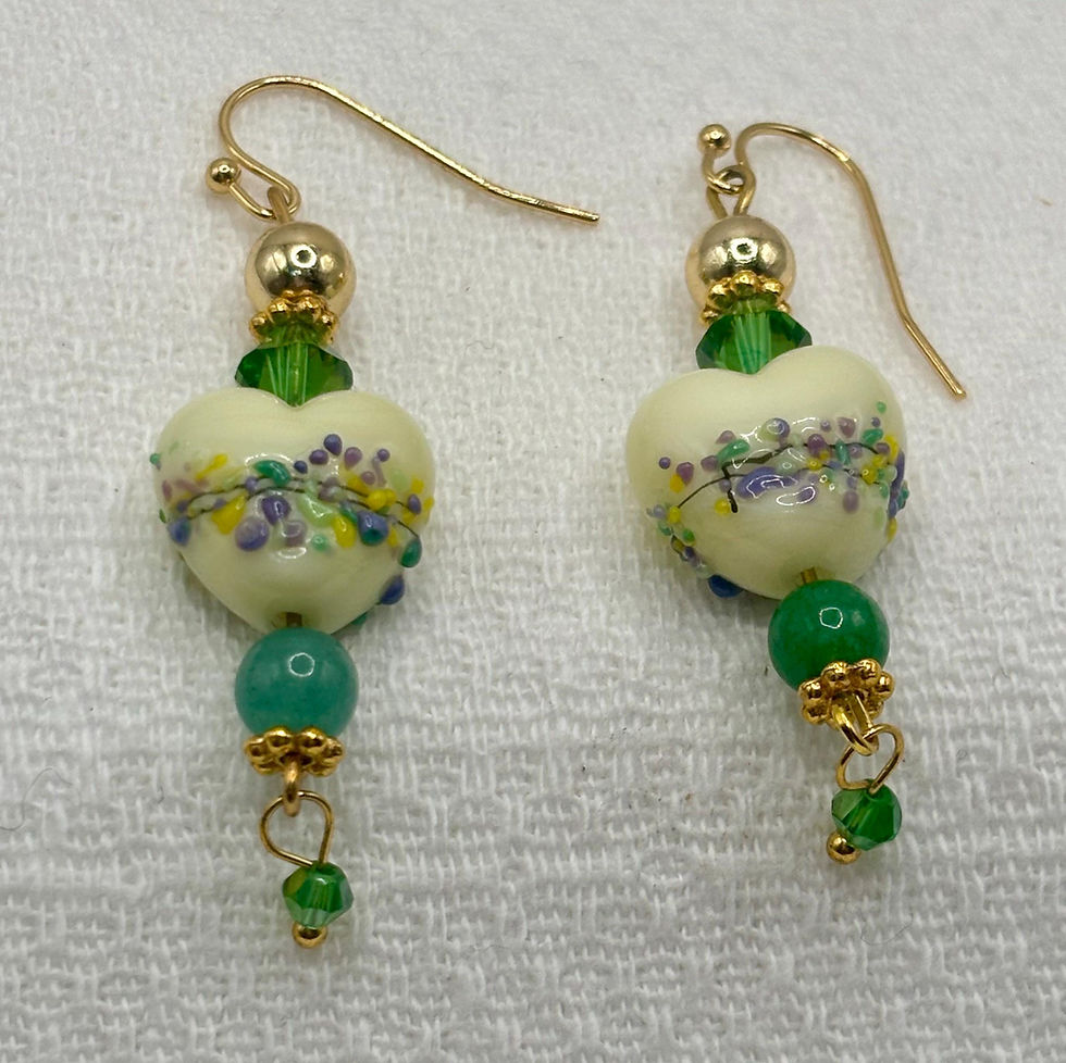 Thumbnail: Pale yellow heart lampwork earrings with green crystals