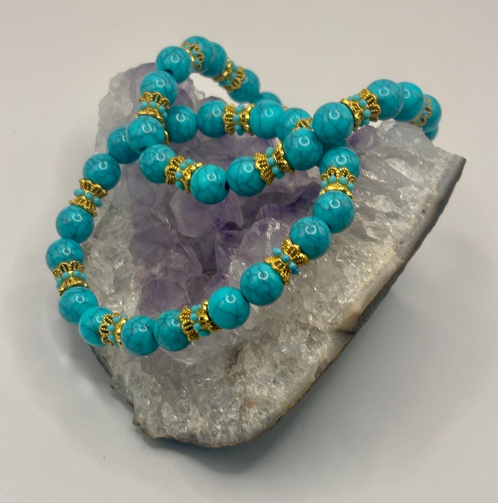 Thumbnail: Turquoise and gold beaded stretch bracelet on amethyst