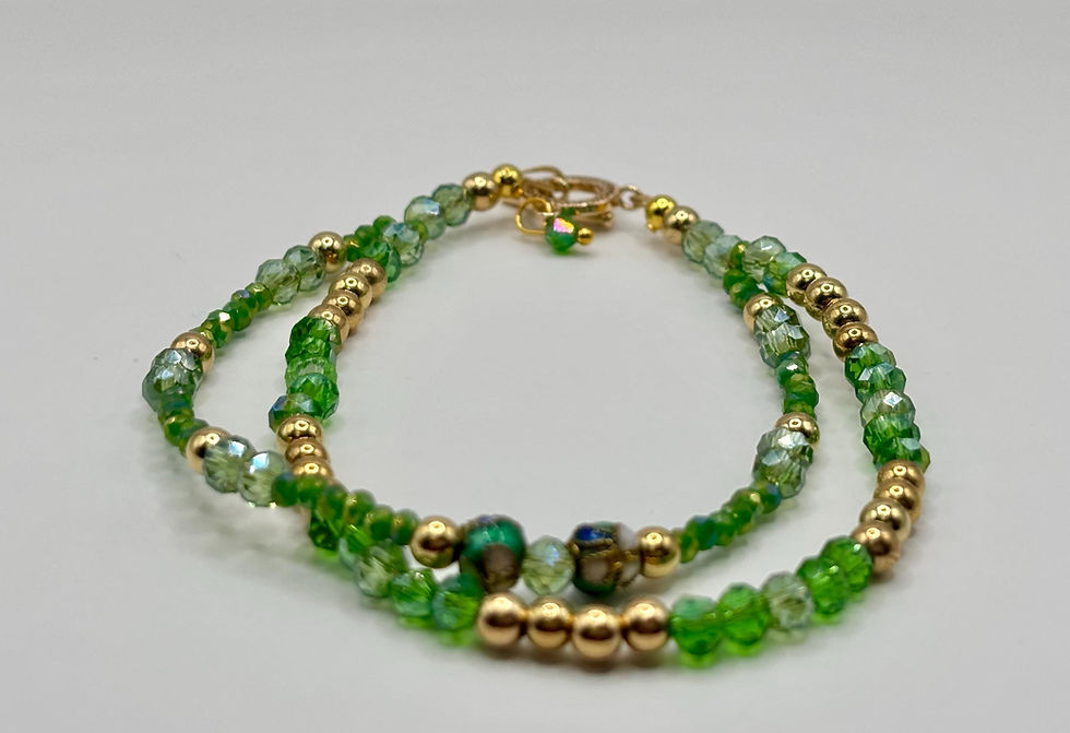 Thumbnail: Green crystal double strand bracelet with gold accents