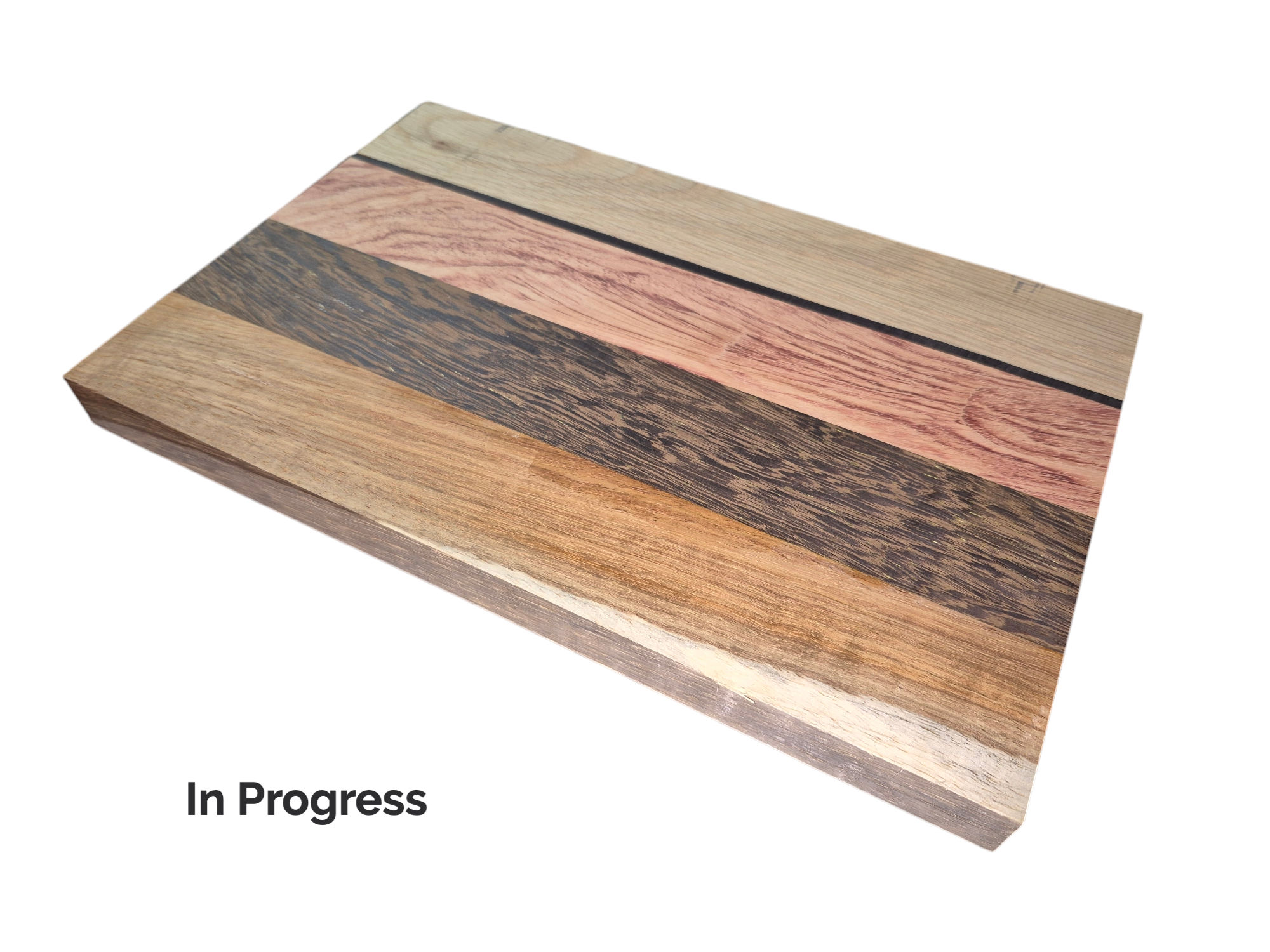 Wooden cheese board with In Progress text, made with Oak, Black Palmwood, Pink Ivory, Ebony and Kiaat Cheese Board 2.