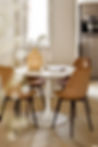 a-dining-room-with-a-white-table-and-wooden-chairs-2023-11-27-05-31-37-utc.jpg