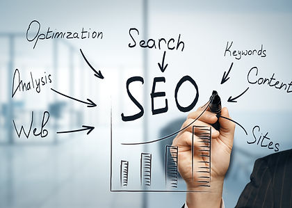 Hand writing SEO with other words pointing to SEO and a graph below