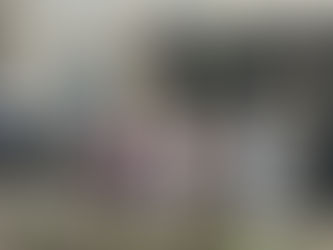 Hannah Bolton (center), the founder and program director of Cardinal Housing Network, was joined by several people, including Douglas County Commissioners, during a ribbon cutting ceremony for a group home in downtown Lawrence that will provide supportive sober housing for women with substance use disorders. The home, located at 1046 New Hampshire St., will have 10 beds for its residents.