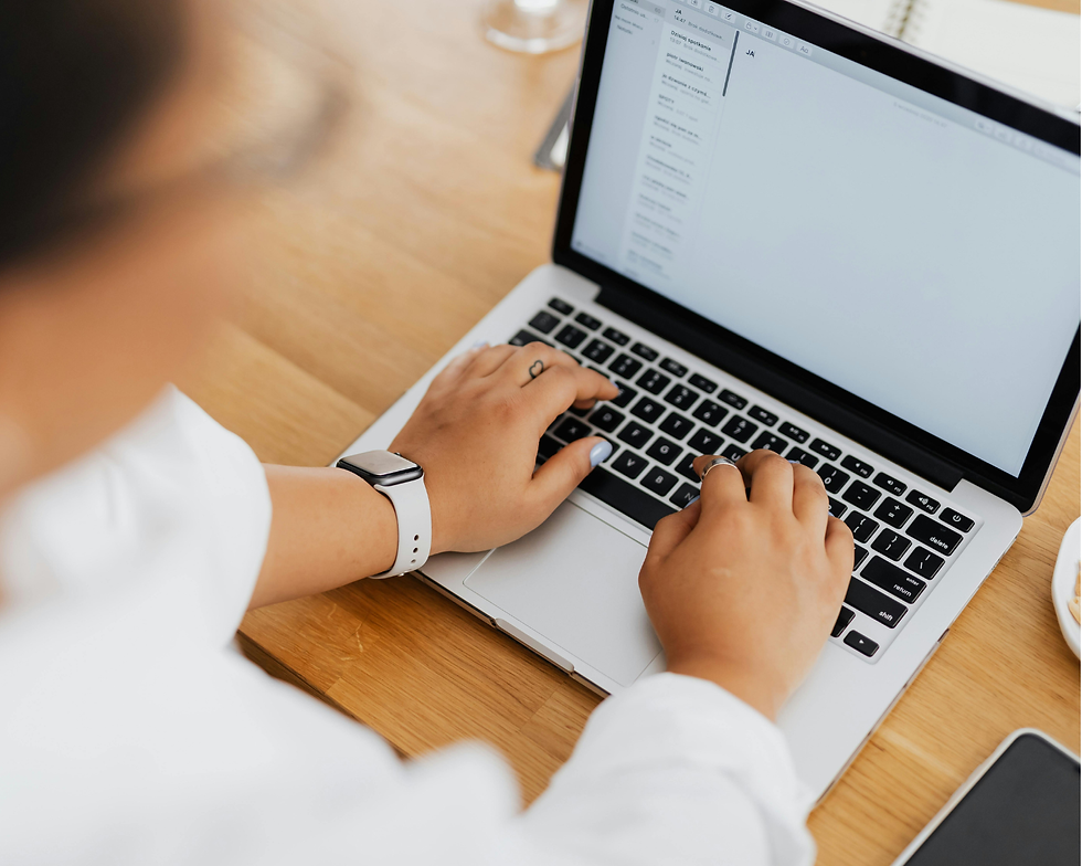A person typing on a laptop