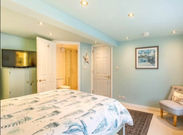 Main Bedroom with Kingsize Bed, Smart TV and En-suite Shower Room.