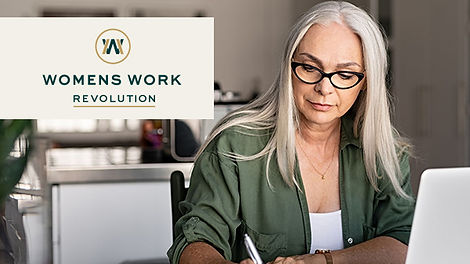 A woman with long grey hair, looking down a her computer, writing notes. 