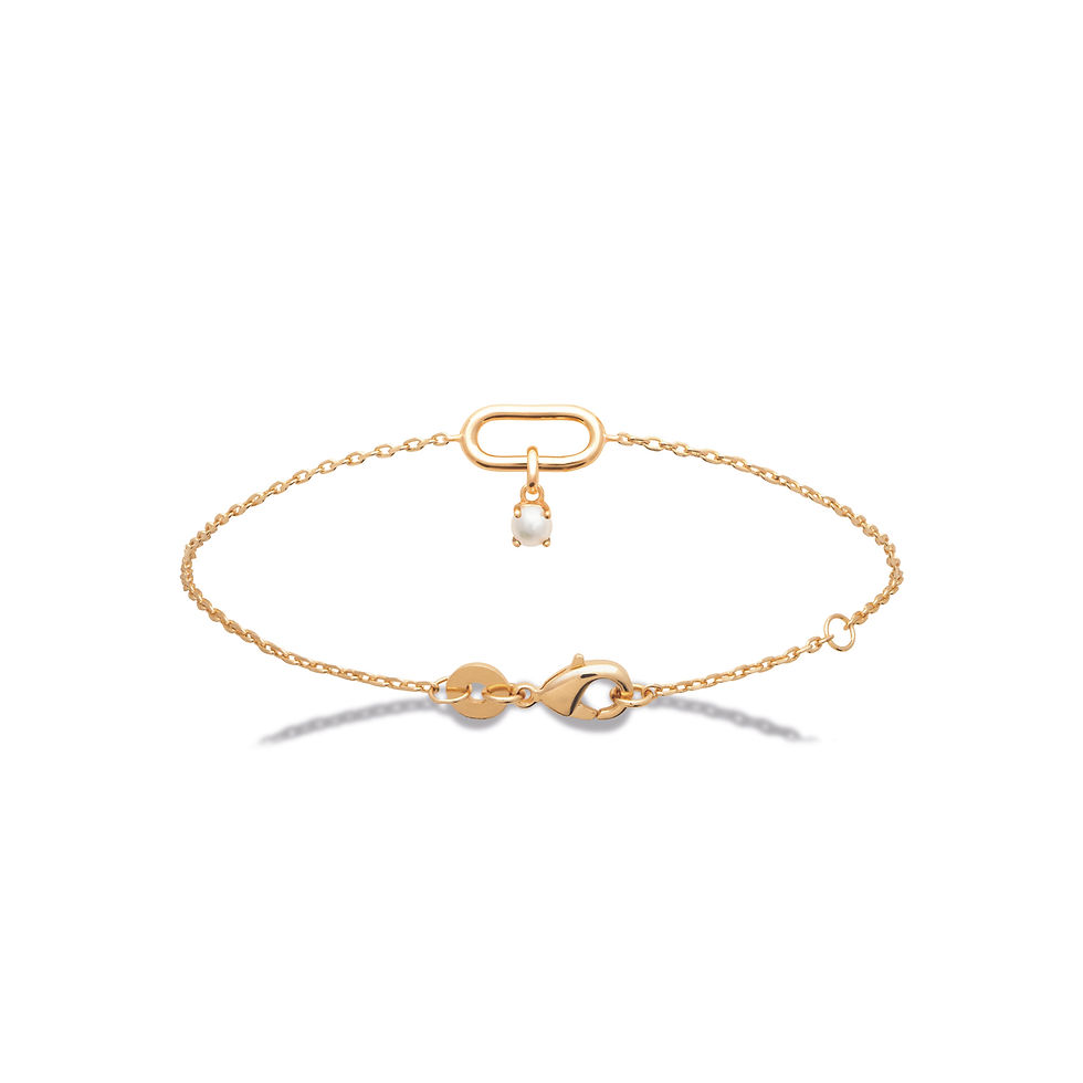 Bracelet fin plaqué or avec perle blanche suspendue et maillon central moderne, bijou élégant pour femme.