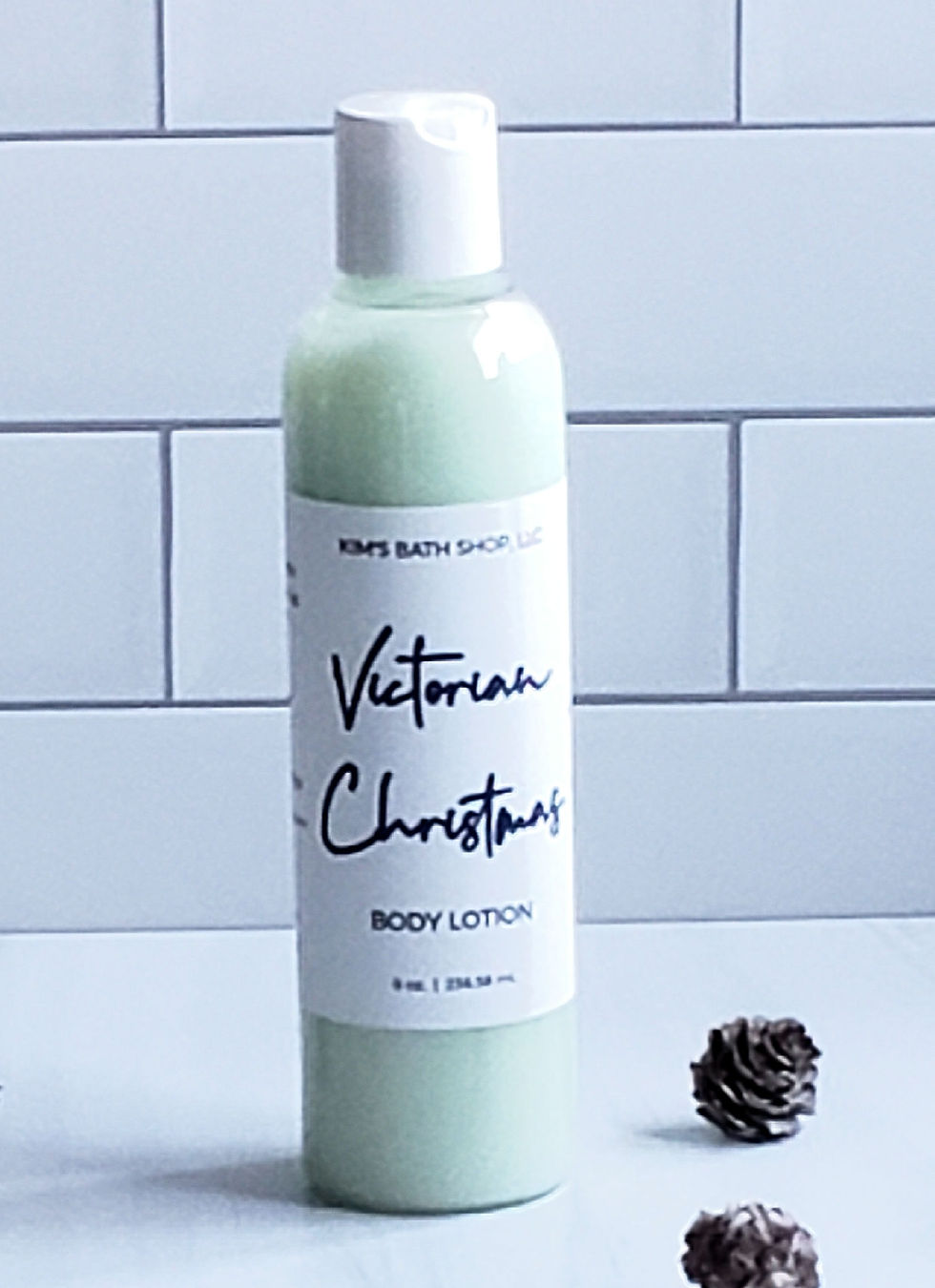 bottle of body lotion with acorns