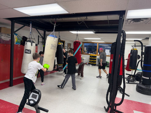 Youth punching heavy bags