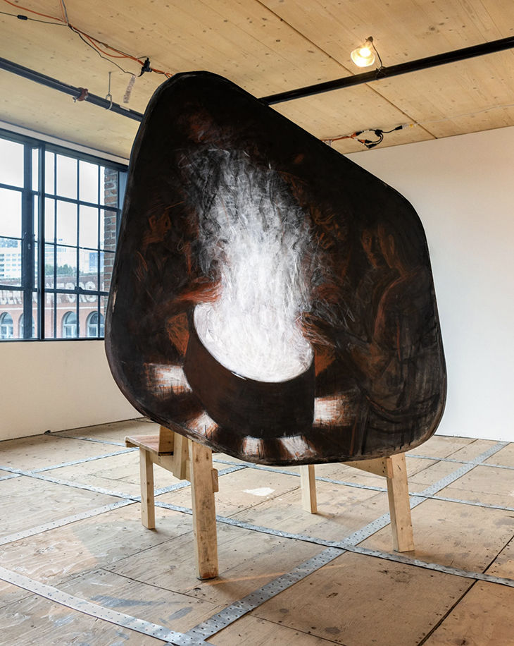 Rachel Dorsey, “Gather / come as u are (shaped canvas 3 / bench piece),” 2024, charcoal, conte crayon, molding paste on canvas stretched over custom wood support structure, 84 x 68 x 30”. Photo: Jacob Chung.