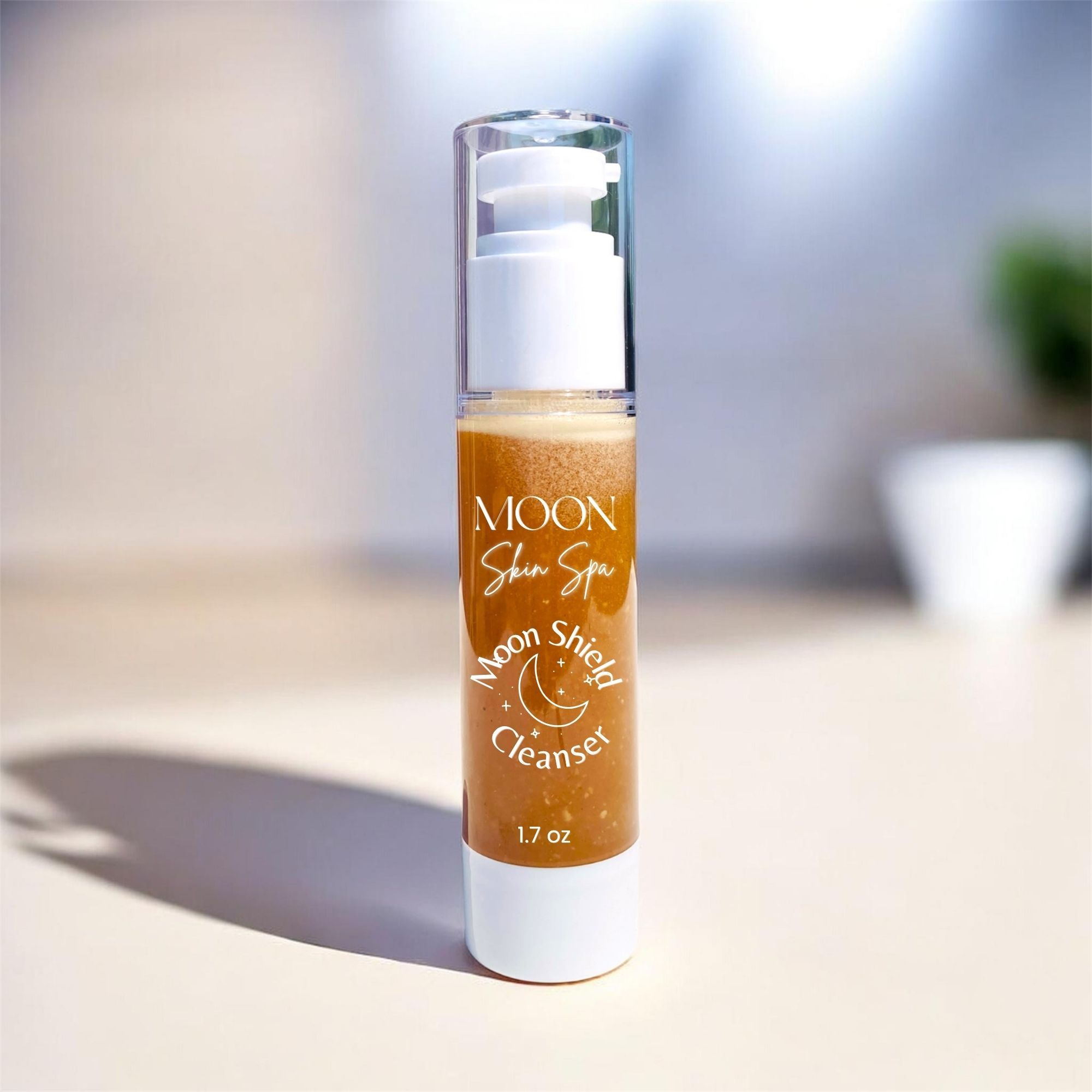 Moon Cleansing Juice Autumn Shield formula in Clear airless skincare bottle