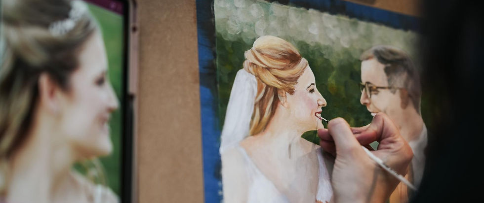 A zoomed in photograph of an artist painting from a digital image which sit side by side.