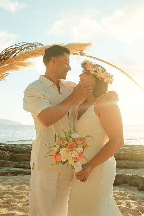 Elopement with personalized beach picnic setup and floral arrangements