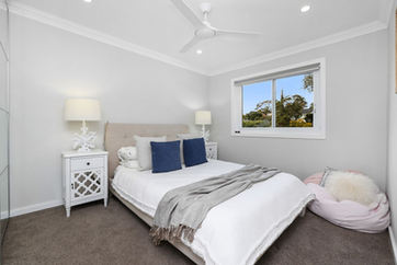 renovated bedroom with new grey carpet.