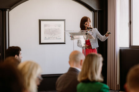 speaker speaking in front of guests at a corporate event in Madrid