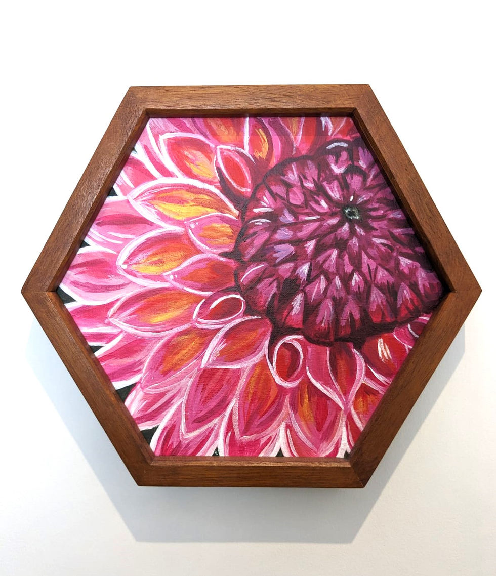 an acrylic painting of a pink chysanthemum on a hexgon canvas, framed
