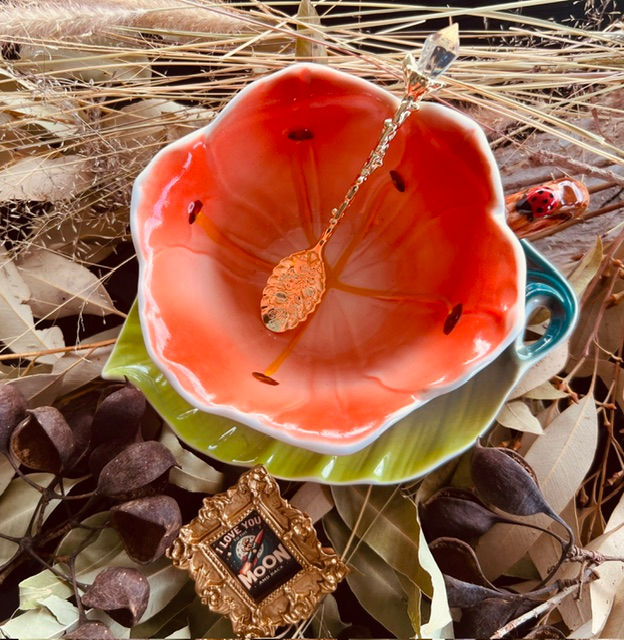 Hand painted ceramic daisy cup and leaf shaped saucer PEACH