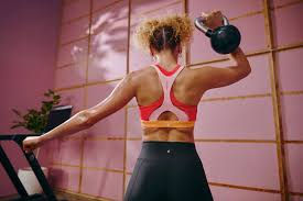 Woman strength training with kettle bell