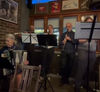 Klezmer musicians performing in a pub