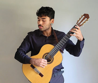 brunette man with acoustic guitar