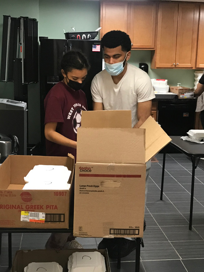 Logan & Olivia Cheeks helping to pack 70 meals to go!
