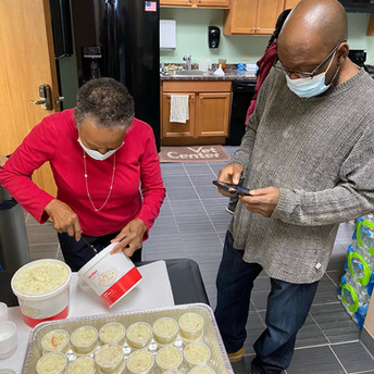 Beaulah Cheeks (Darryl's mom) portioning coleslaw. Darryl Cheeks (Beaulah's baby) doing quality control.