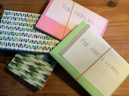 Bundles of cards ready to be included in A Safe Place's welcome packages for arriving families.