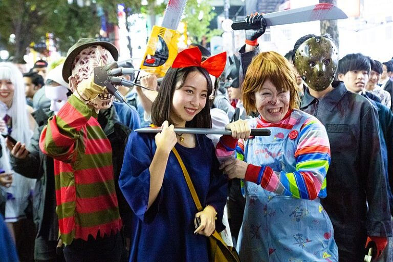 cosplayers in shibuya celebrating halloween. kiki, jason and chucky