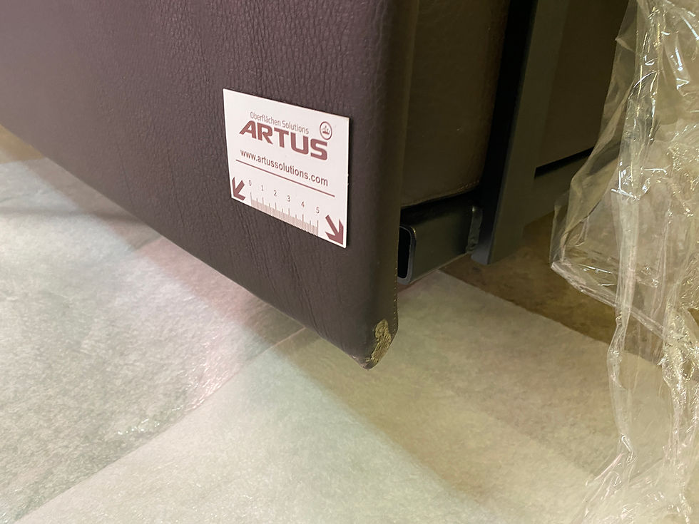 Damage to a leather sofa before repair