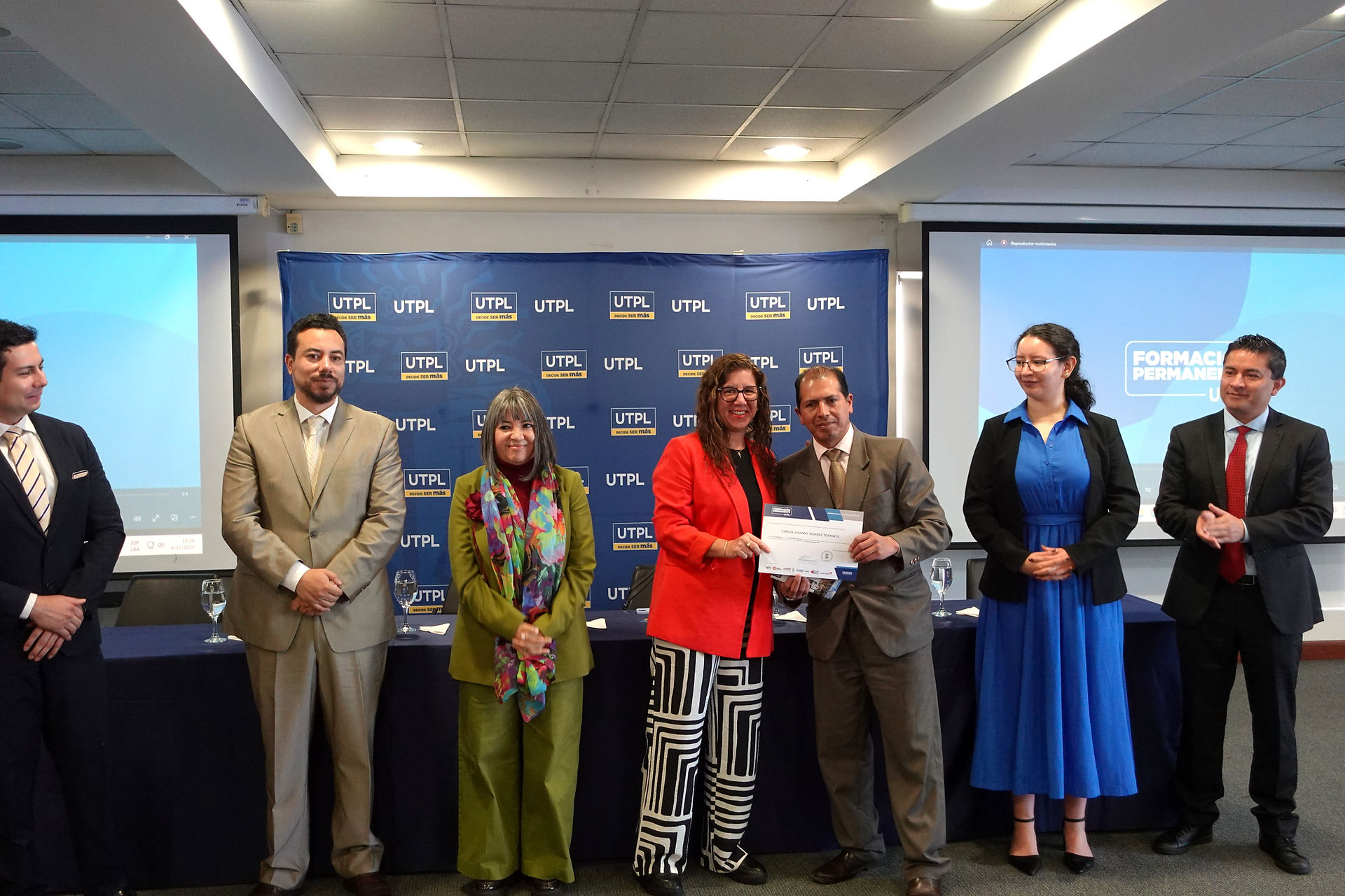 Participant receiving a certificate during the Courier School closing event