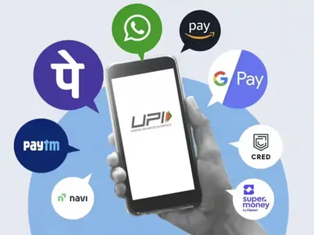 Indian tourist using UPI mobile app to pay at a store in UAE via QR code.