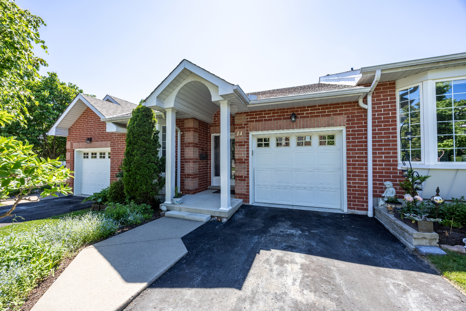 Exterior view of an elegant independent living bungalow with professional landscaping.