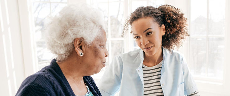 A mixed-race caregiving daughter talks to her elderly black mother.