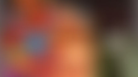 A woman with butterflies covering her head smoking a cigarette