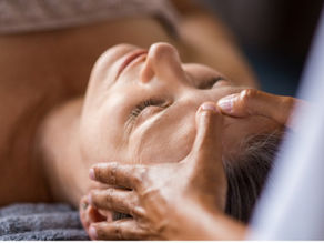 women receiving relaxing head massage