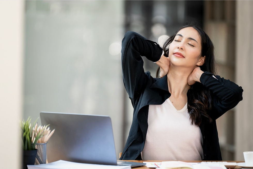 women working at here desk with neck pain
