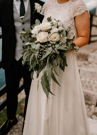 Bride and her flowers. Destination Wedding at Lake Garda, Italy. With Amy Woodham Photography.