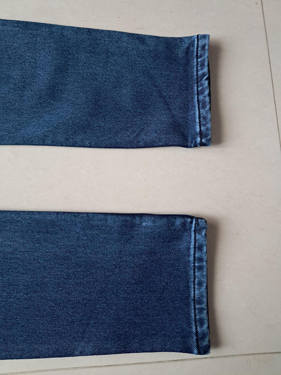 Thumbnail: Blue washing shade denim jean cuffs