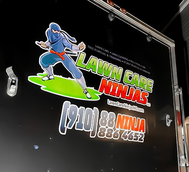 Business logo printed on trailer exterior — mobile branding by Montana Custom Art