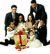 A multi-generational family is gathered around an oversized gift, eagerly anticipating its contents. Preparing to open