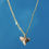Thumbnail: fossilized cream shark tooth necklace