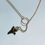 Thumbnail: dainty shark tooth necklace