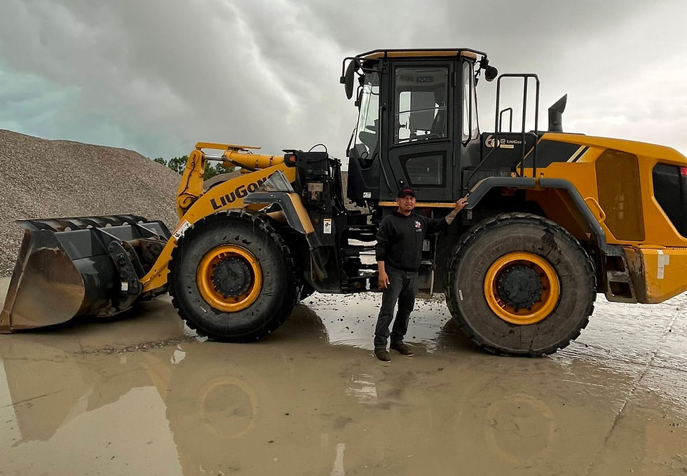 Joe standing in front of his LiuGong Loader.